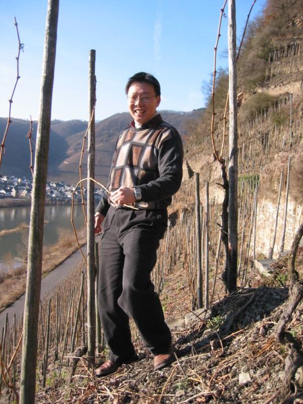 Mr. Cheung bends a branch