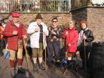 A group of mountain hikers stop for a glass of hot wine